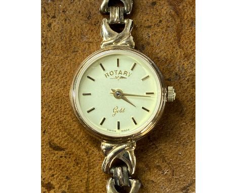 ROTARY ‘GOLD’ 9CT GOLD LADIES’ WRISTWATCH & BRACELET with circular case, champagne dial, baton hour markers and quartz moveme