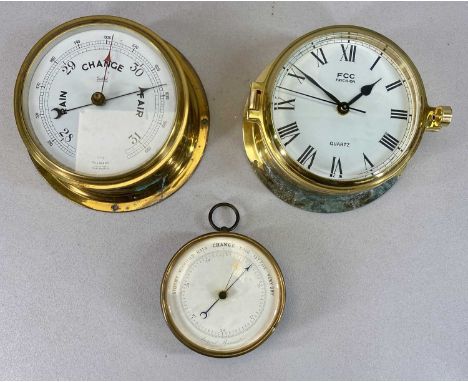 THREE MARINE INSTRUMENTS comprising late 19th Century brass encased aneroid barometer having white enamel dial, 12.5cms (diam