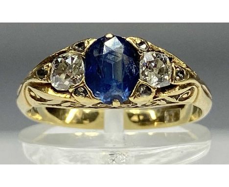 18CT GOLD RING set with central sapphire, flanked by diamonds, size M, 3.9gms Provenance: private collection Ynys Môn