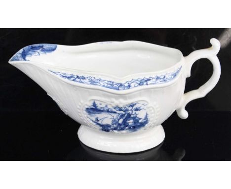 A Worcester porcelain sauce boat, circa 1770, the body with moulded cartouches underglaze printed in the Fisherman and Billbo