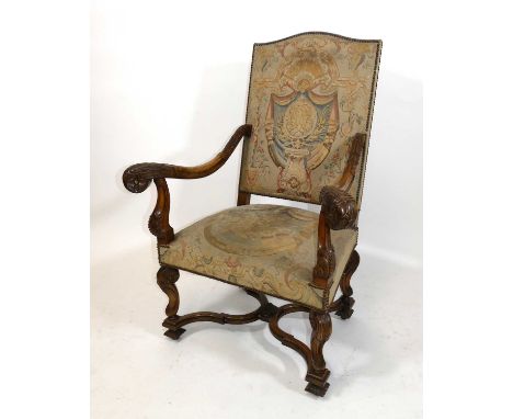 A Caroleon style walnut framed and upholstered armchair, late 19th century, having tapestry back and stuffover seat, swept an