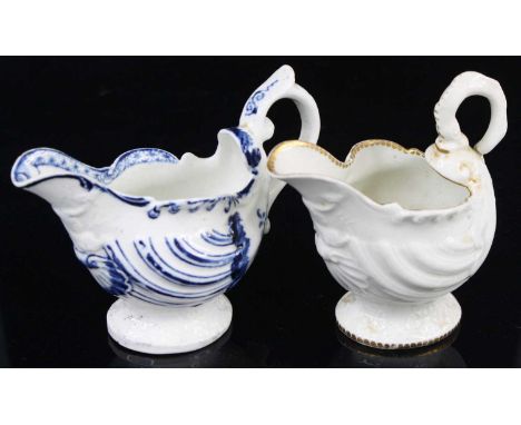 A Derby porcelain dolphin ewer cream jug, circa 1760-70, decorated in relief with shell moulding and underglaze painted in bl