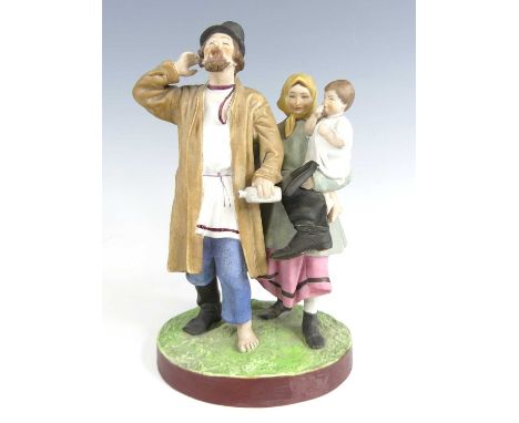 A Russian Gardner bisque porcelain figure group, 19th century, modelled as a young peasant family, raised upon an oval plinth
