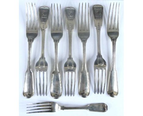 A set of seven George III silver table forks, in the Fiddle &amp; Thread pattern, each terminal engraved verso with stag trip