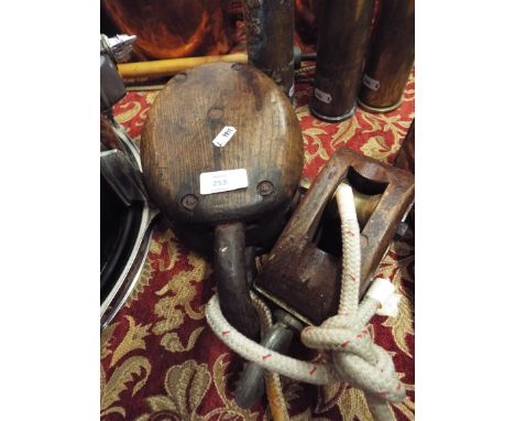 Two vintage wooden and metal pulleys 