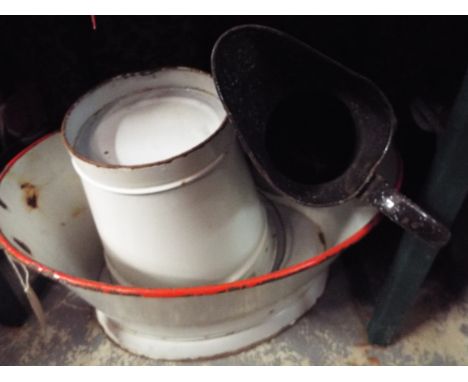 A vintage enamel bath together with an enamel bucket and jug