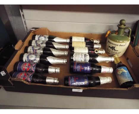 A selection of vintage bottles of beer to include 'Ind Coope' strong beer Courage 'Ceremonial' Ale commemorating the wedding 