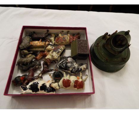 A selection of vintage diecast farmyard animals and a post-war diecast round base searchlight by Astra