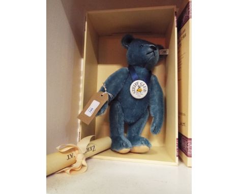 An original Steiff teddy bear 1908 blue bear having blue mohair jointed and shoe button eyes and porcelain chest tag boxed co