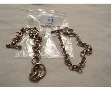 Two silver bracelets      heart one stamped '925' to large ring and import mark to T-bar, ball one stamped 'Mexico 925' to ri