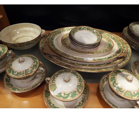 A selection of Booth's 'Green Dragon' pattern dinner-ware to include four graduated meat plates and five chocolate cups and s