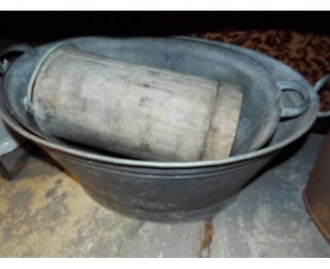 Two vintage metal baths together with a tall metal bucket