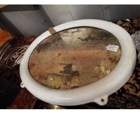 A cast iron and enamel oval ship's mirror, reputedly from the Harlan & Wolf shipyard 1909