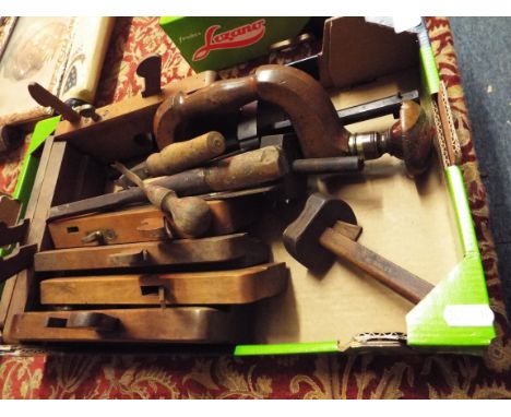 A good selection of early 20thC wooden and brass carpenters tools comprising of a brace, rebate planes and mortice gauges