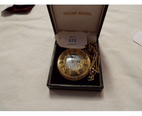 A gold plated Mount Royal half-hunter pocket watch the enamel dial with Roman numerals and subsidiary dial complete with fob 