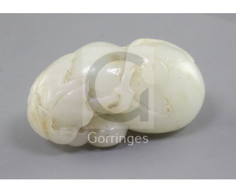 A Chinese white jade carving of gourds, 18th/19th century, carved in high relief and openwork with branches and leaves, the s