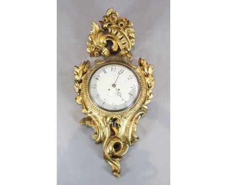 J Eckstrom of Stockholm. A Swedish carved giltwood cartel clock, with painted dial, the case signed A. Lundmark, height 36in.