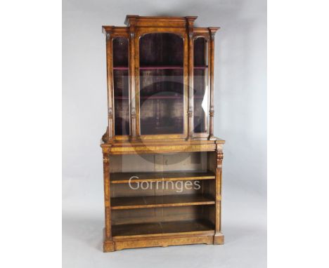 A Victorian burr walnut and marquetry cabinet on bookshelf, by Wilkinson &amp; Son, with moulded cornice, fitted with an arch