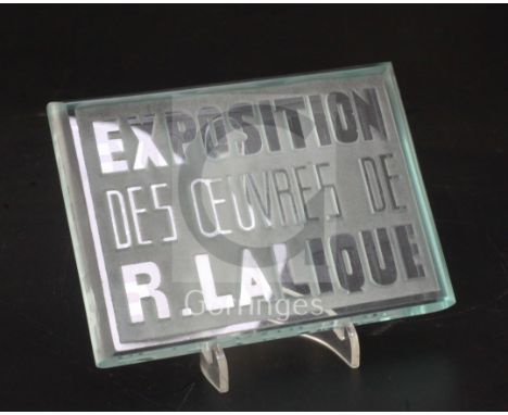 An inter-war period 'Exposition Des Oeuvres De R. Lalique' exhibition plaque, introduced in 1931, in green tinted clear and f