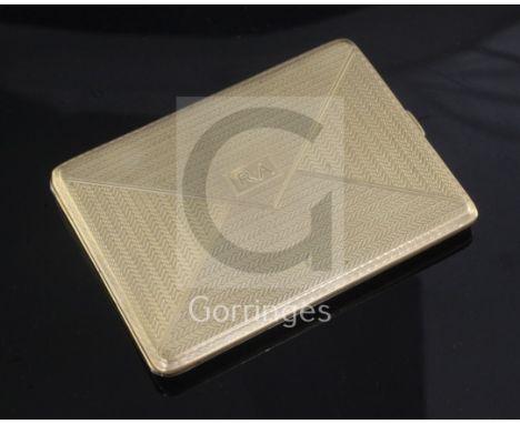 A 1920's engine turned 9ct. gold "envelope" cigarette case, 11.5cm.