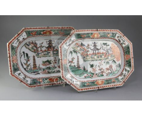 A pair of Chinese export famille verte canted rectangular meat dishes, Kangxi period, each painted with pavilions and city wa