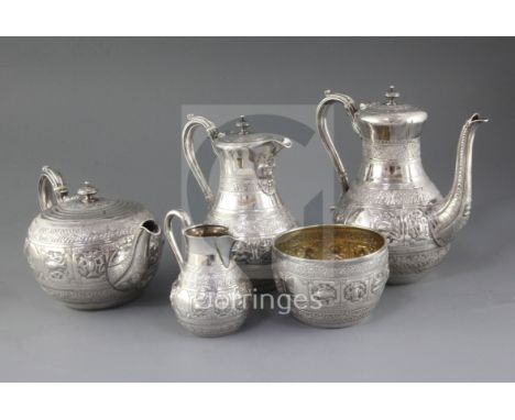 A good Victorian five piece silver tea and coffee service by Frederick Elkington, with engraved crest and decorated and embos