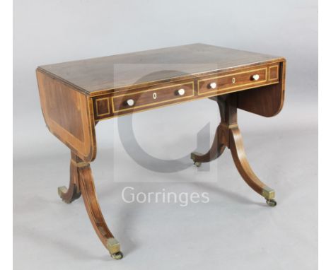 A Regency boxwood strung rosewood sofa table, with D shaped flaps and two frieze drawers with turned ivory knob handles, W.3f