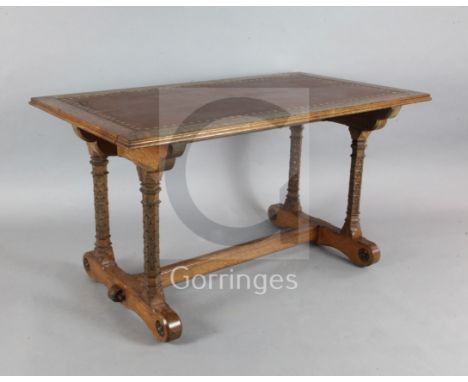 Attributed to A. W. N. Pugin (1812-52). A mid 19th century Reformed Gothic oak writing table, supplied by John Webb and possi