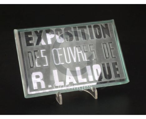 An inter-war period 'Exposition Des Oeuvres De R. Lalique' exhibition plaque, introduced in 1928, in green tinted clear and f