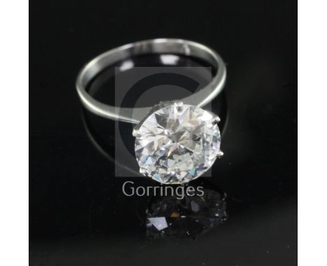 A platinum and solitaire diamond ring, with an old insurance valuation estimating the round brilliant cut stone to weigh 3.06