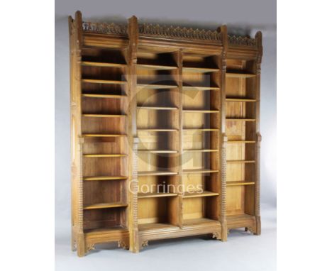 Attributed to A.W.N. Pugin. A mid 19th century Reformed Gothic oak breakfront open bookcase, probably made by J.G.Crace, with