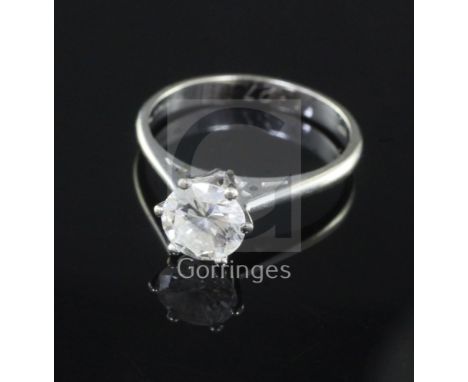 A modern 18ct white gold and solitaire diamond ring, the round brilliant cut stone weighing 1.27cts, size O/P.