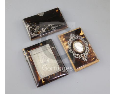 Three Victorian tortoiseshell and silver inlaid card cases, the first inset with a shell cameo portrait, the second with an e