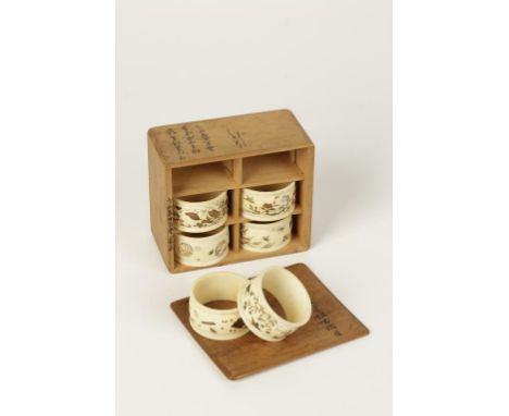 A SET OF SIX JAPANESE SHIBYAMA IVORY NAPKIN RINGS with gilt bird and applied mother of pearl floral decoration amongst insect