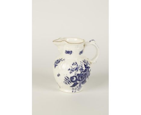 A FIRST PERIOD WORCESTER TYPE PORCELAIN JUG with transfer printed floral decoration, on a cabbage leaf moulded ground, 19th c
