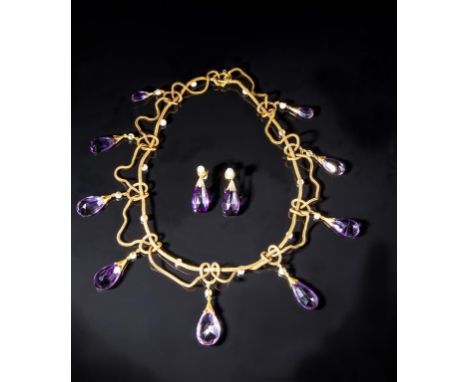 A SUITE OF AMETHYST AND PEARL JEWELLERY comprising a necklace with nine graduated tear-drop shaped amethysts suspended from p
