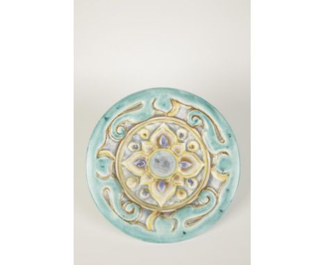 A CLARICE CLIFF BIZARRE WILKINSON POTTERY MADALION WALL PLAQUE "INSPIRATION" of circular form with raised border and embossed