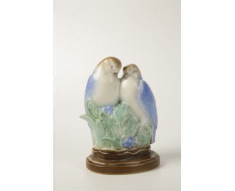 A POOLE POTTERY EARTHENWARE MODEL IN THE FORM OF ‘LOVE BIRDS’ Shape No. 808, decorated in a spray glazed picotee colours, des