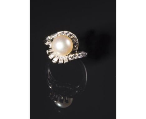 A 1950'S DIAMOND AND PEARL COCKTAIL RING with a central pearl in a crossover setting with brilliant and baguette-cut diamonds