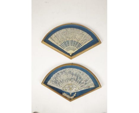 A MOTHER OF PEARL AND LACE FAN the staves with silvered and gilt scrolls and putti - gilt case, 9 1/4" radius and another, iv