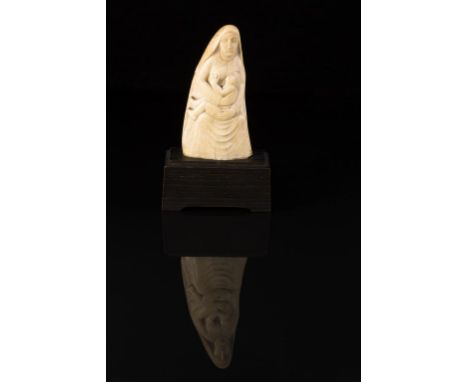 ERIC GILL (1882 - 1940) "Madonna and Child", a marine ivory, executed circa 1922, 7" high, 6" excluding the original wooden b