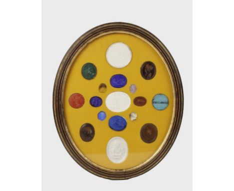 A COLLECTION OF SIXTEEN COLOURED AND CLEAR GLASS "TASSIE" TYPE GEMS, each cast in intaglio with a Roman scene or portrait, th