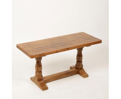 •ROBERT "MOUSEMAN"THOMPSON (b. 1876 - d.1955): AN ARTS AND CRAFTS STYLE PALE OAK COFFEE TABLE, the adzed rectangular top supp