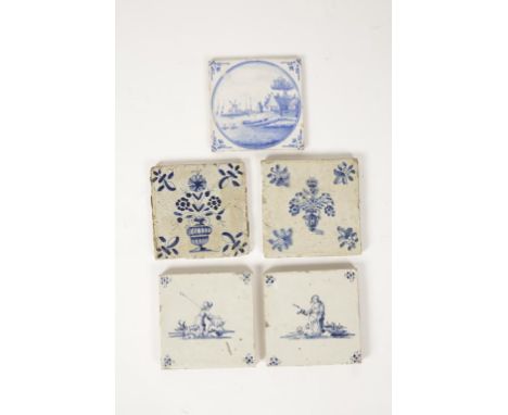 A PAIR OF DELFTWARE TIN-GLAZED TILES painted in blue with a shepherd and shepherdess with sheep, and three other similar Delf