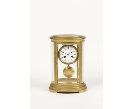 A BRASS "FOUR GLASS" OVAL MANTEL CLOCK, the shaped bevel edged glass panels enclosing a white enamel dial with Roman numerals