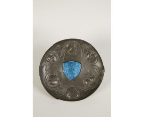 ARCHILBALD KNOX FOR LIBERTY & CO, THE BOLLELLIN SHIELD: A Tudric pewter and enamel dish, circular form with raised boarders, 
