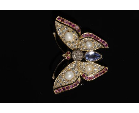A GEM-SET BUTTERFLY BROOCH the body composed of diamonds and an elongated oval sapphire and the wings each set with four pear