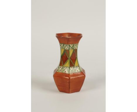 A CLARICE CLIFF BIZARRE NEWPORT POTTERY VASE "ORIGINAL BIZARRE" of hexagonal waisted form, decorated in tones of burnt orange