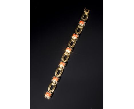 A BOUCHERON YELLOW GOLD BRACELET set with rectangular cabochon corals within black enamel borders interspersed with canted re