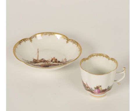 A MEISSEN PORCELAIN CUP AND SAUCER polychrome painted with a lake scene with figures and buildings beyond, the saucer similar